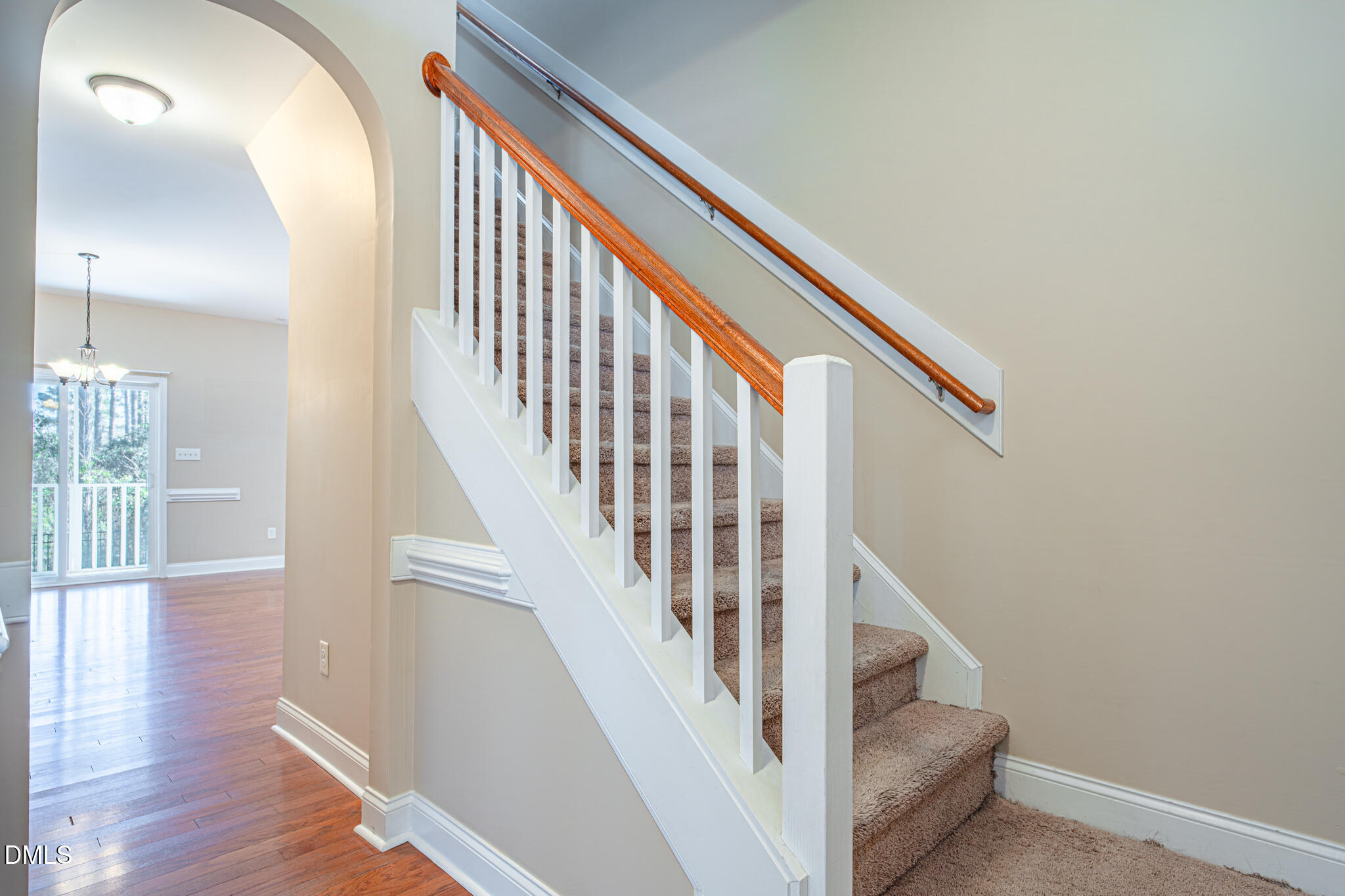 403 Rolling Pines Drive Spring Lake, NC 28390 - Photo 8 of 56 a view of staircase with wooden floor and white walls