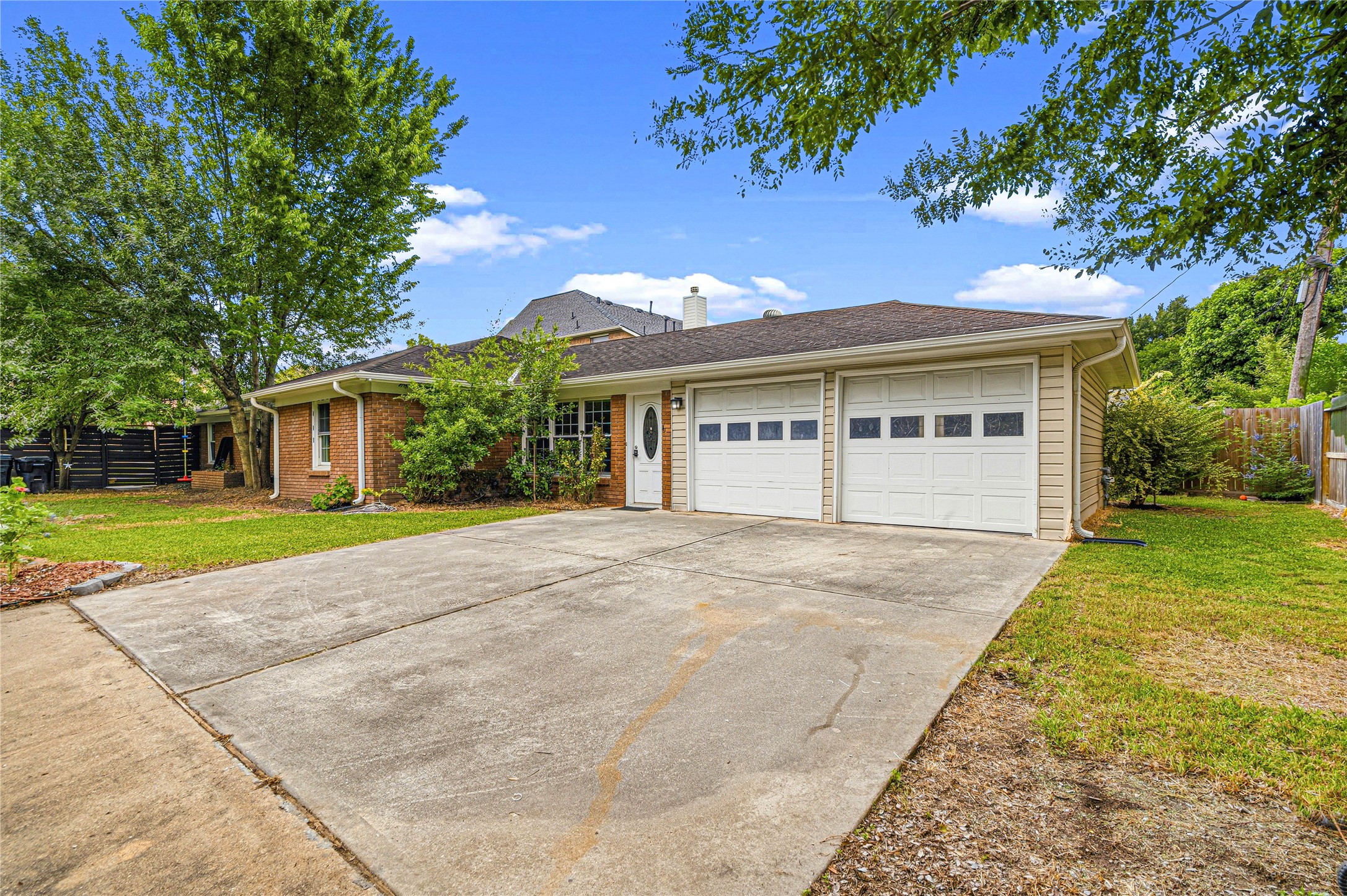 4002 Merrick Street Houston, TX 77025 - Photo 21 of 22 a view of a house with a yard
