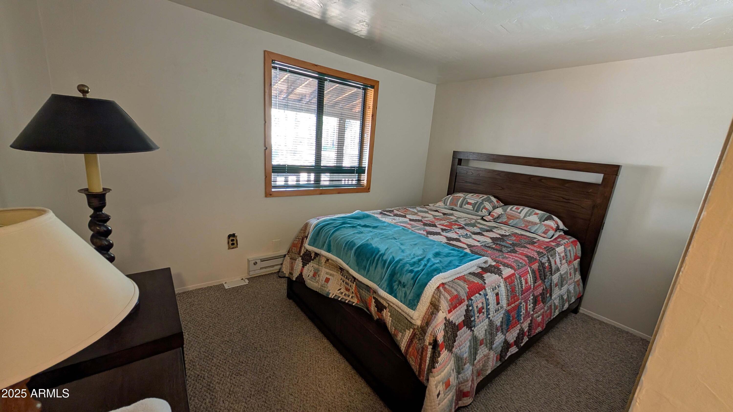 2425 Tall Trees Loop Forest Lakes, AZ 85931 - Photo 22 of 43 a bedroom with a bed and a window