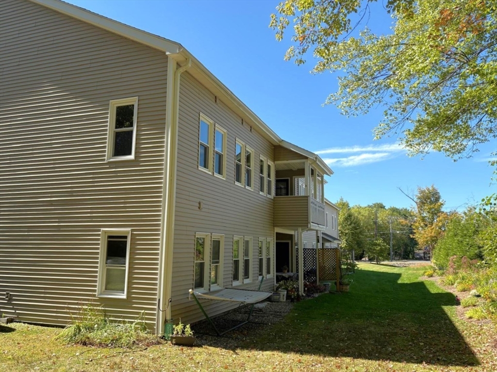 500 West Street, Unit 6 Amherst, MA 01002 - Photo 3 of 20 a front view of a house with a yard