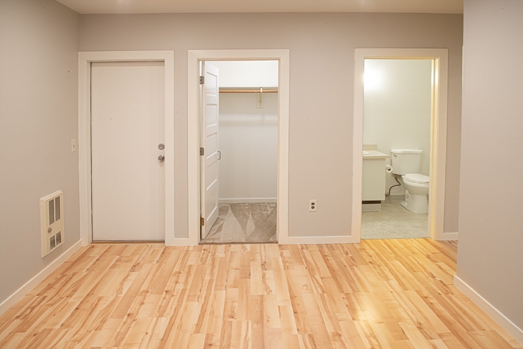 500 West Street, Unit 6 Amherst, MA 01002 - Photo 7 of 20 a view of a room with wooden floor and bathroom