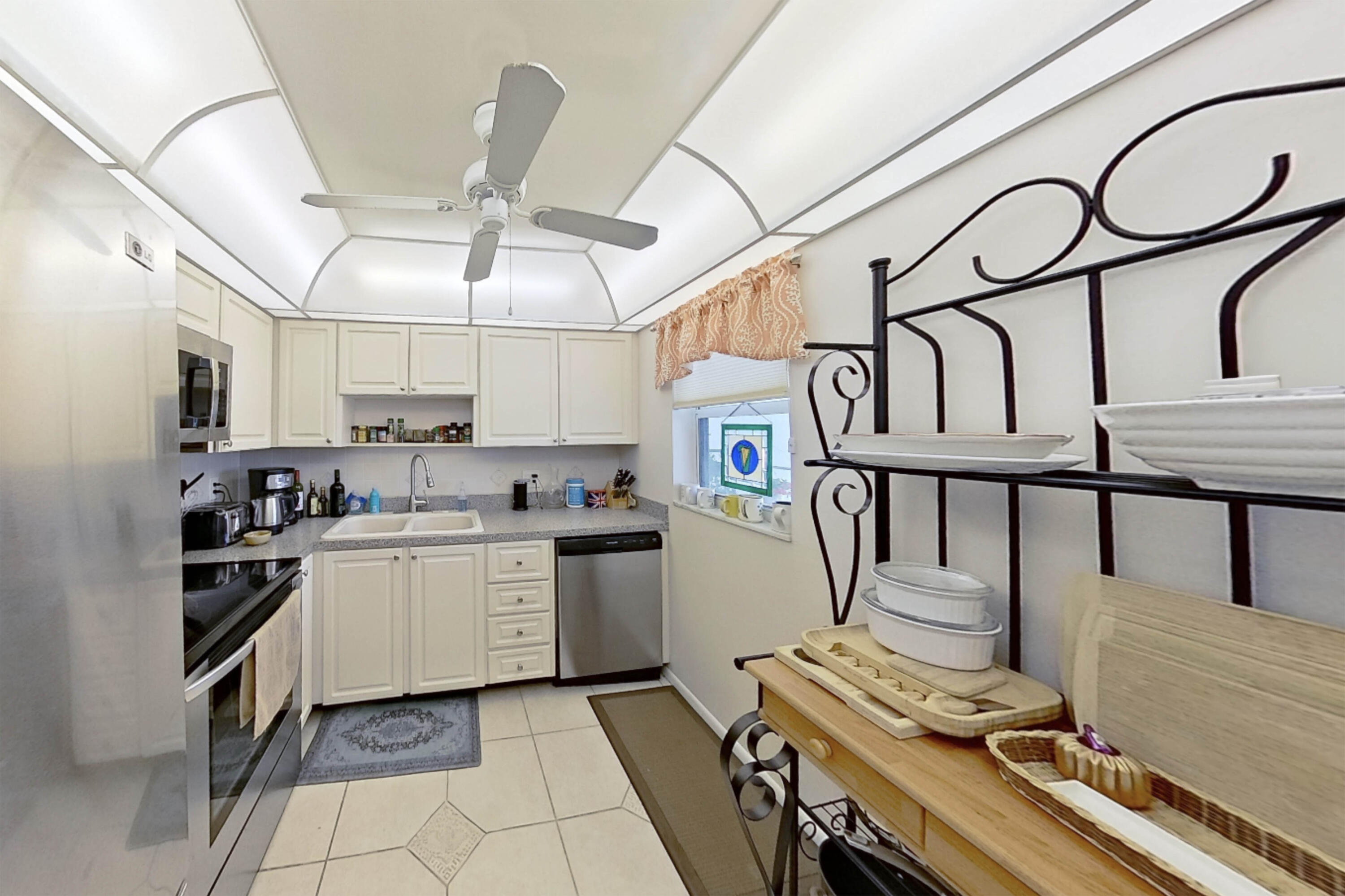 336 Golfview Road, Unit 518 North Palm Beach, FL 33408 - Photo 12 of 31 a kitchen with cabinets appliances and furniture