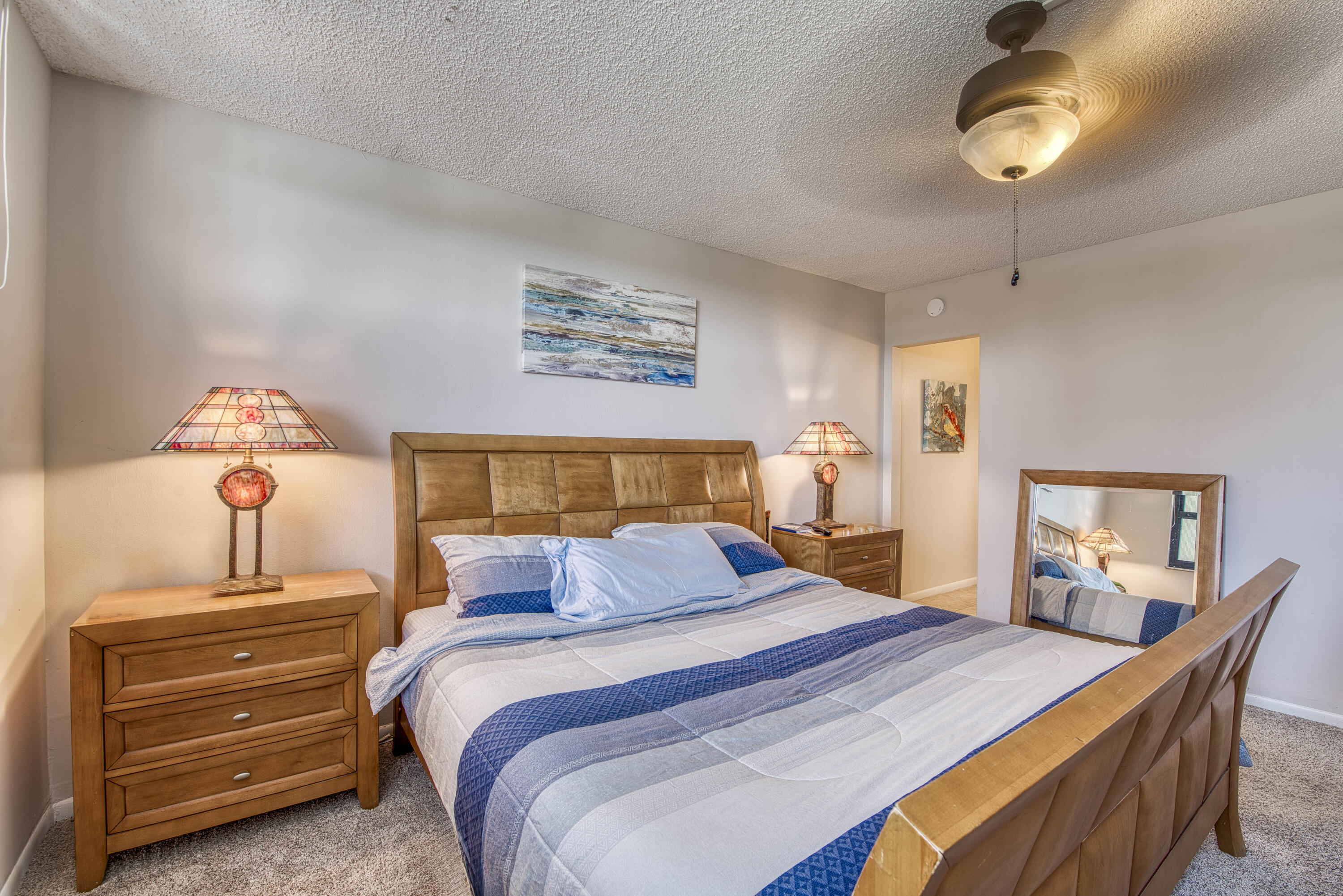 336 Golfview Road, Unit 518 North Palm Beach, FL 33408 - Photo 14 of 31 a bedroom with a bed and a chandelier