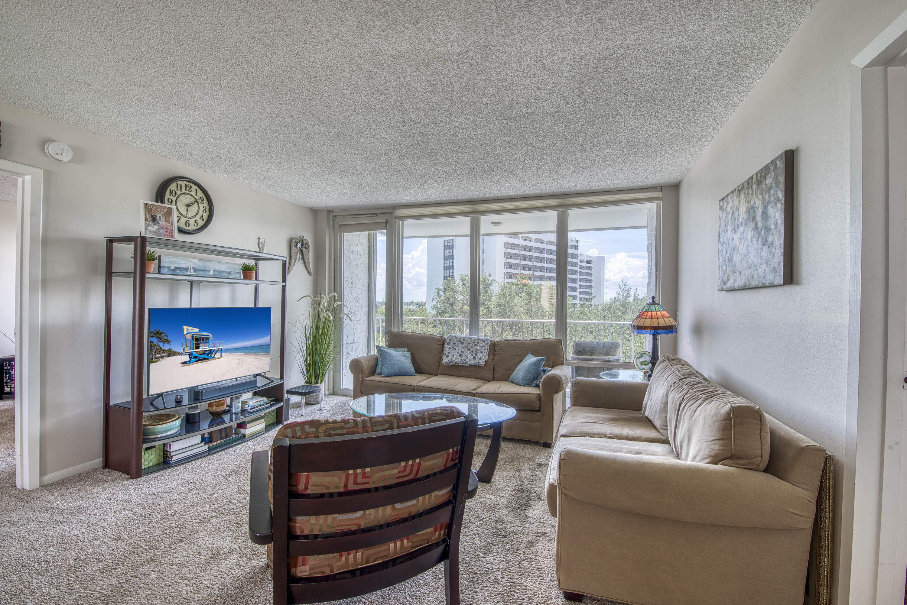 336 Golfview Road, Unit 518 North Palm Beach, FL 33408 - Photo 2 of 31 a living room with furniture and a large window