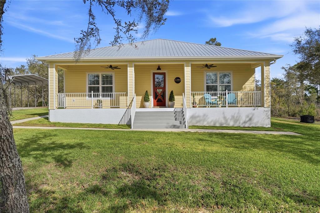 2204 Re Byrd Road Frostproof, FL 33843 - Photo 2 of 49 a view of a house with a backyard