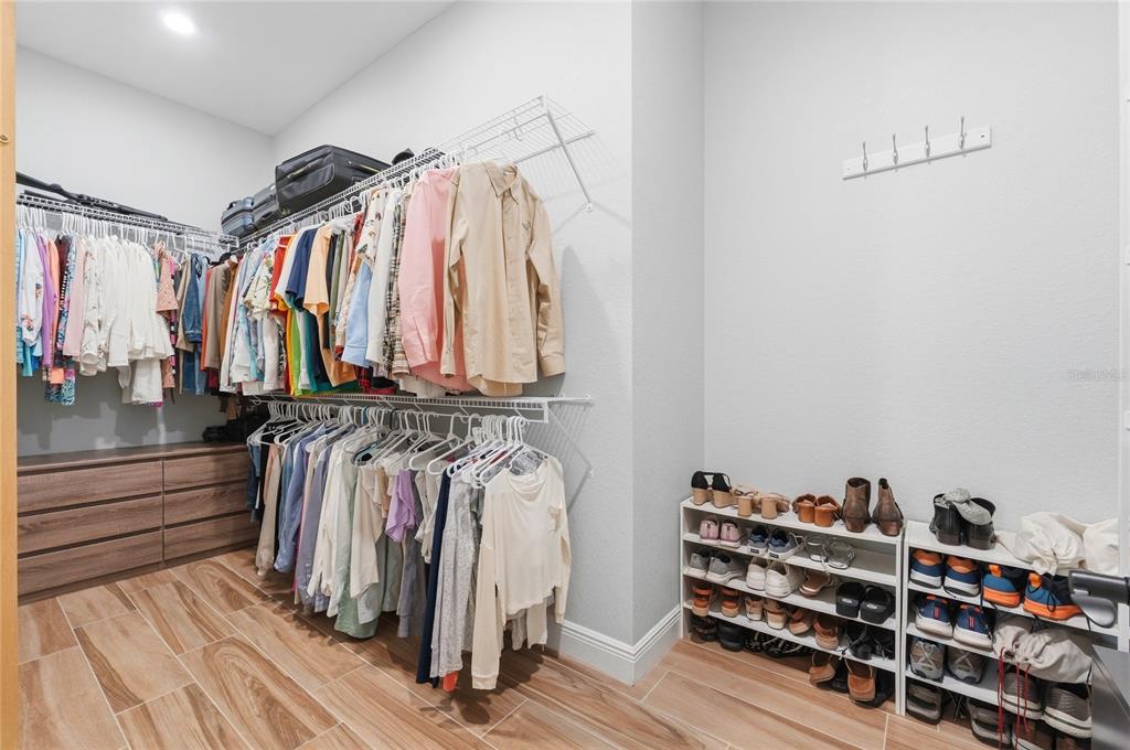 2204 Re Byrd Road Frostproof, FL 33843 - Photo 22 of 49 a view of walk in closet with clothes and shoes