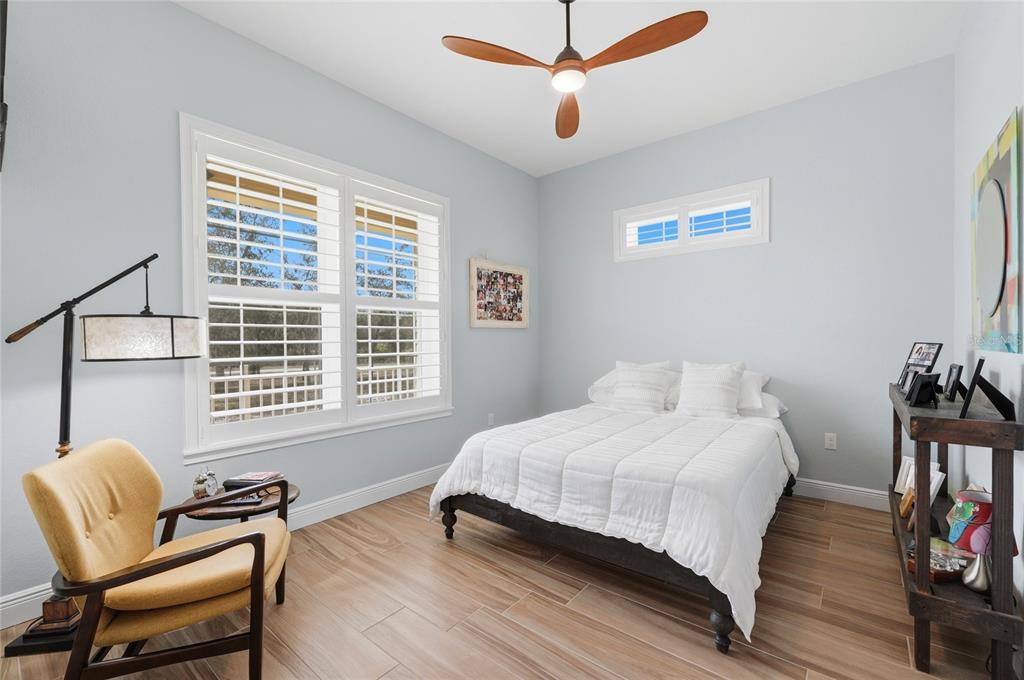 2204 Re Byrd Road Frostproof, FL 33843 - Photo 23 of 49 a bedroom with a bed and a chair
