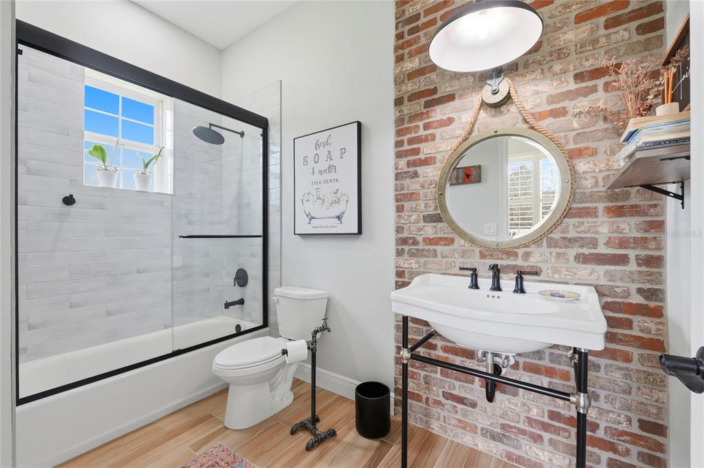 2204 Re Byrd Road Frostproof, FL 33843 - Photo 25 of 49 a bathroom with a sink mirror vanity and toilet