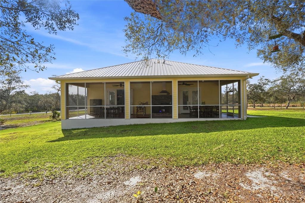 2204 Re Byrd Road Frostproof, FL 33843 - Photo 30 of 49 a view of a garden with a large tree