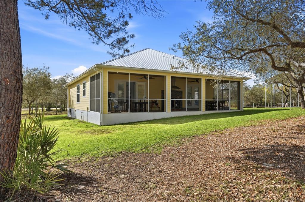 2204 Re Byrd Road Frostproof, FL 33843 - Photo 31 of 49 a view of a house with a garden