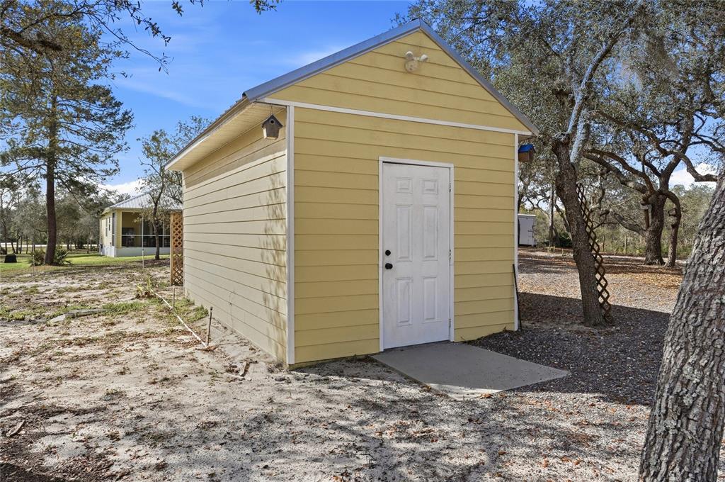 2204 Re Byrd Road Frostproof, FL 33843 - Photo 34 of 49 a view of a house with a yard
