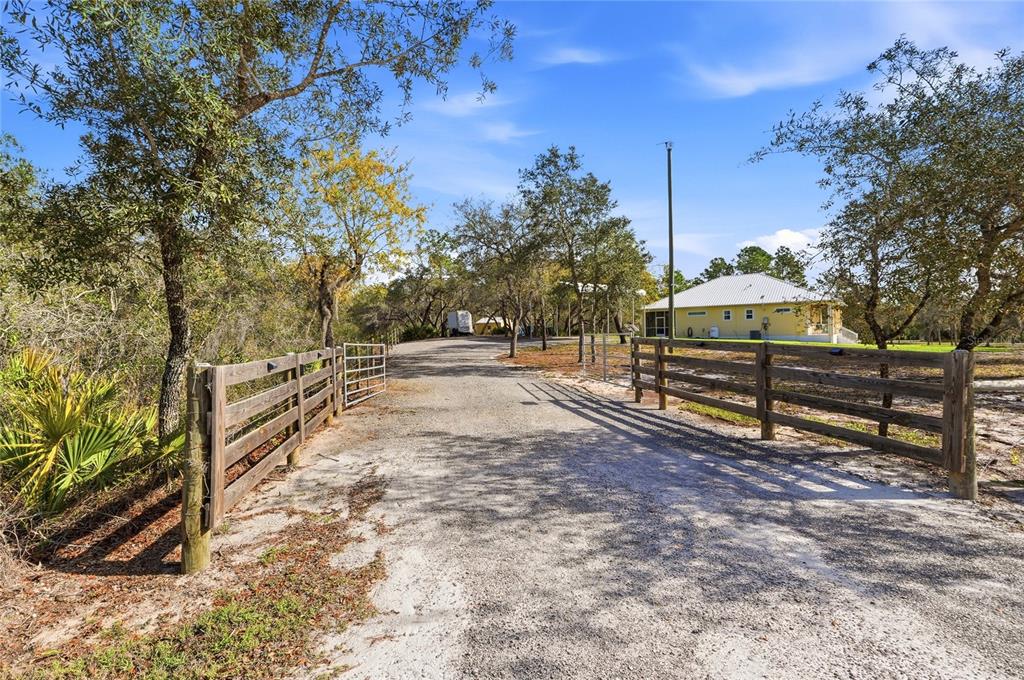 2204 Re Byrd Road Frostproof, FL 33843 - Photo 37 of 49 a view of street with trees in the background