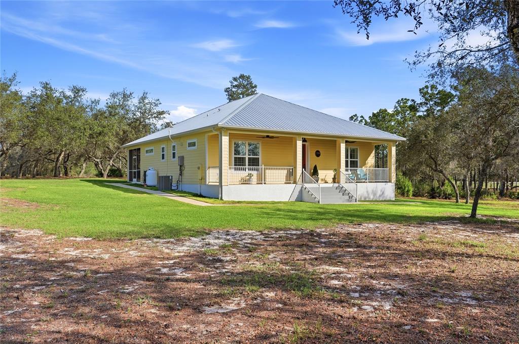 2204 Re Byrd Road Frostproof, FL 33843 - Photo 41 of 49 a front view of a house with a yard