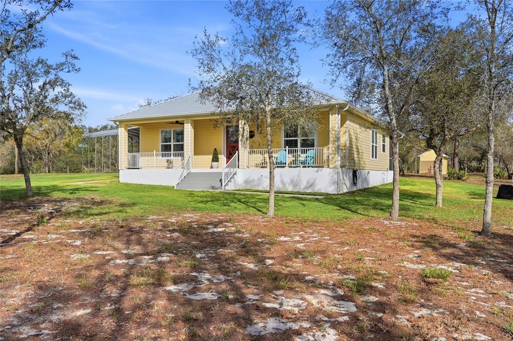 2204 Re Byrd Road Frostproof, FL 33843 - Photo 42 of 49 a view of a house with a yard