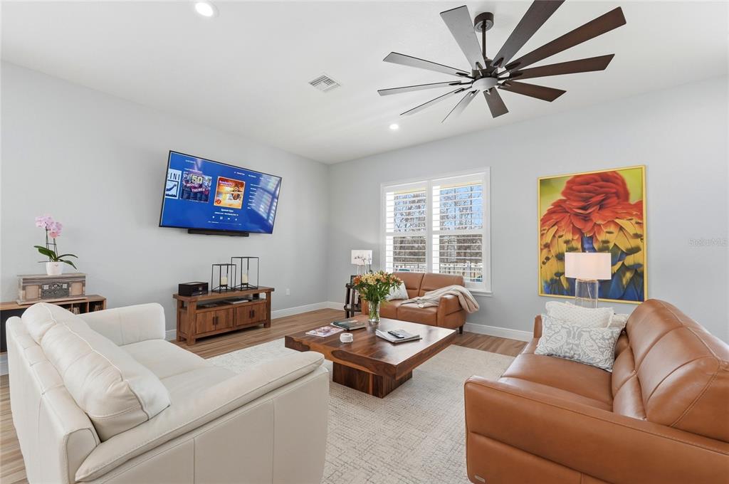 2204 Re Byrd Road Frostproof, FL 33843 - Photo 5 of 49 a living room with furniture ceiling fan and a window