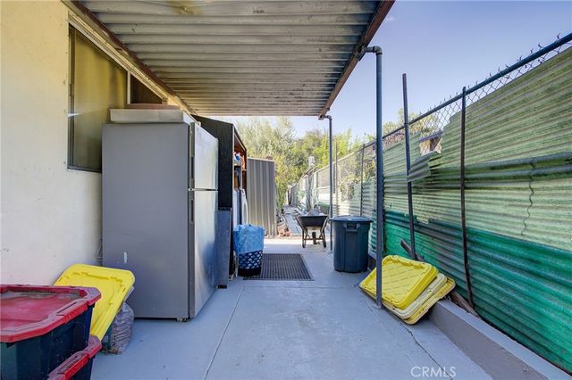 a view of a backyard with a chair and a couch