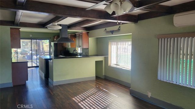 a view of a kitchen with a sink and cabinets