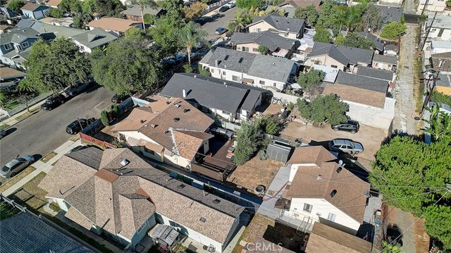 an aerial view of a house with a yard