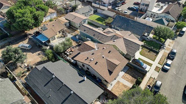 an aerial view of a house with a yard