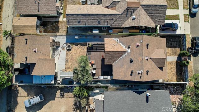 an aerial view of residential houses with outdoor space
