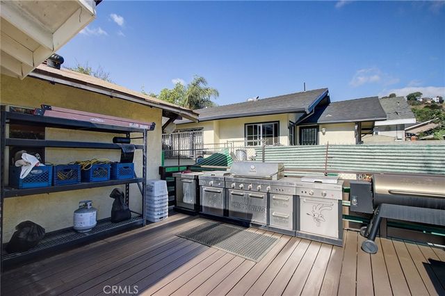 a view of a chairs and table in a balcony