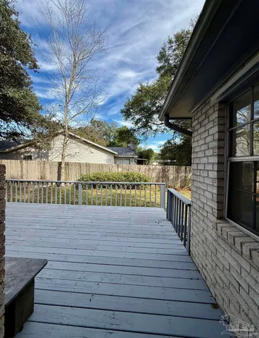 a view of a balcony with wooden floor