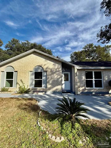 a house view with a garden space
