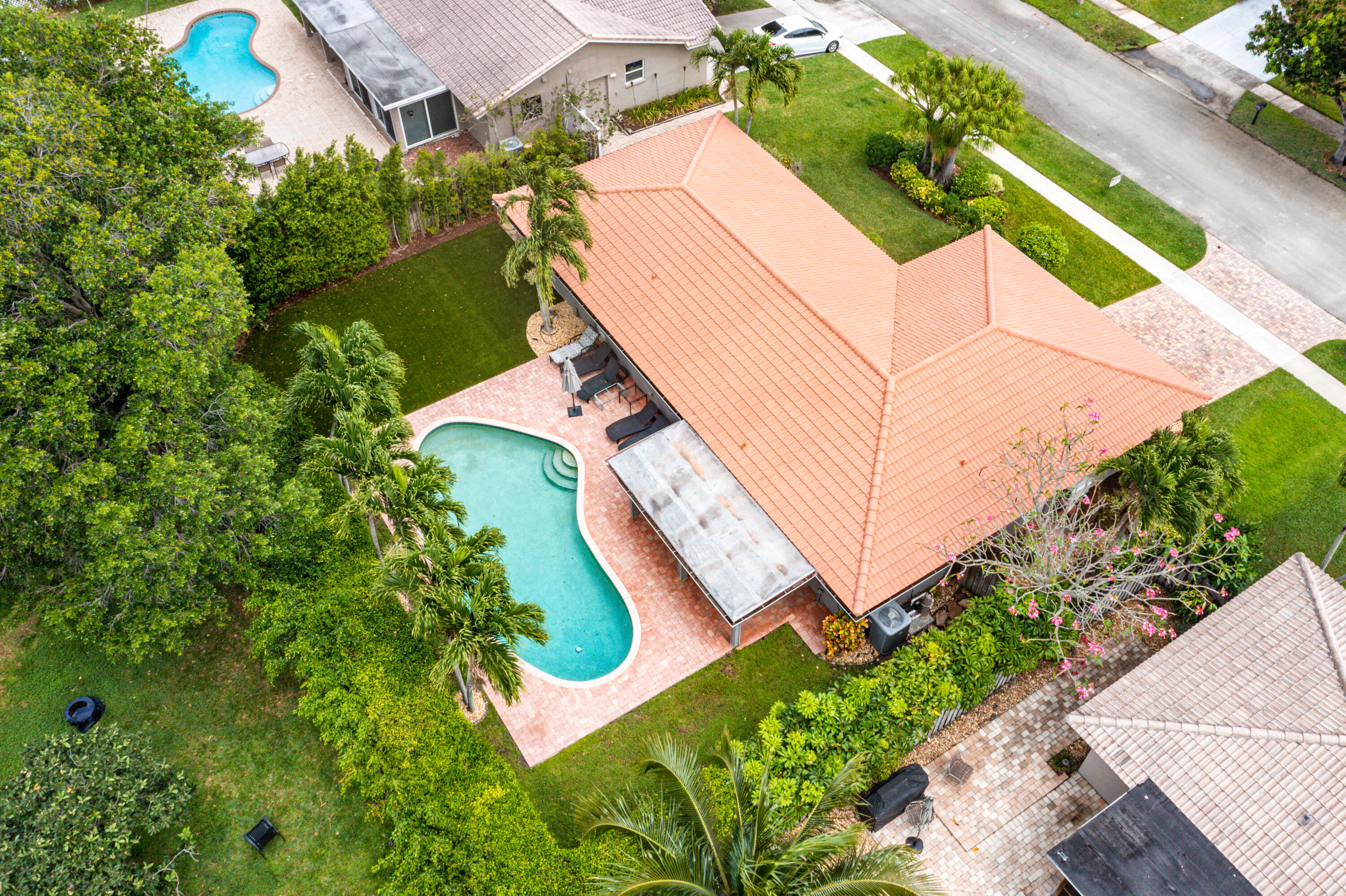 3289 Northwest 26th Avenue Boca Raton, FL 33434 - Photo 5 of 10 an aerial view of a house with a yard and large trees