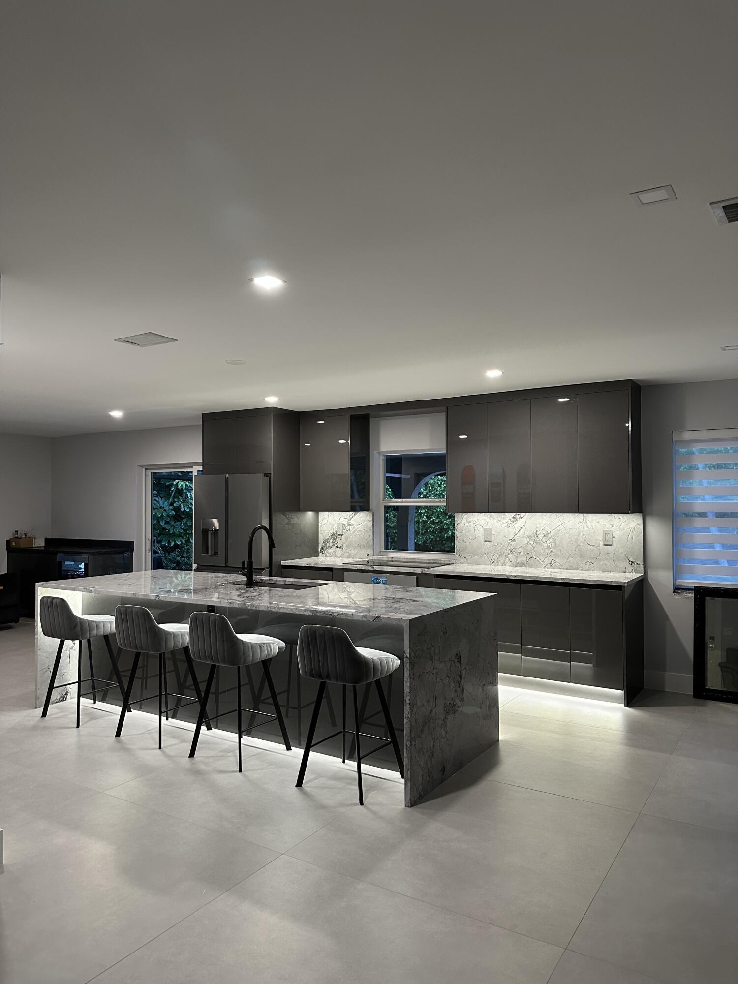 3289 Northwest 26th Avenue Boca Raton, FL 33434 - Photo 7 of 10 a view of a dining room with furniture window and wooden floor