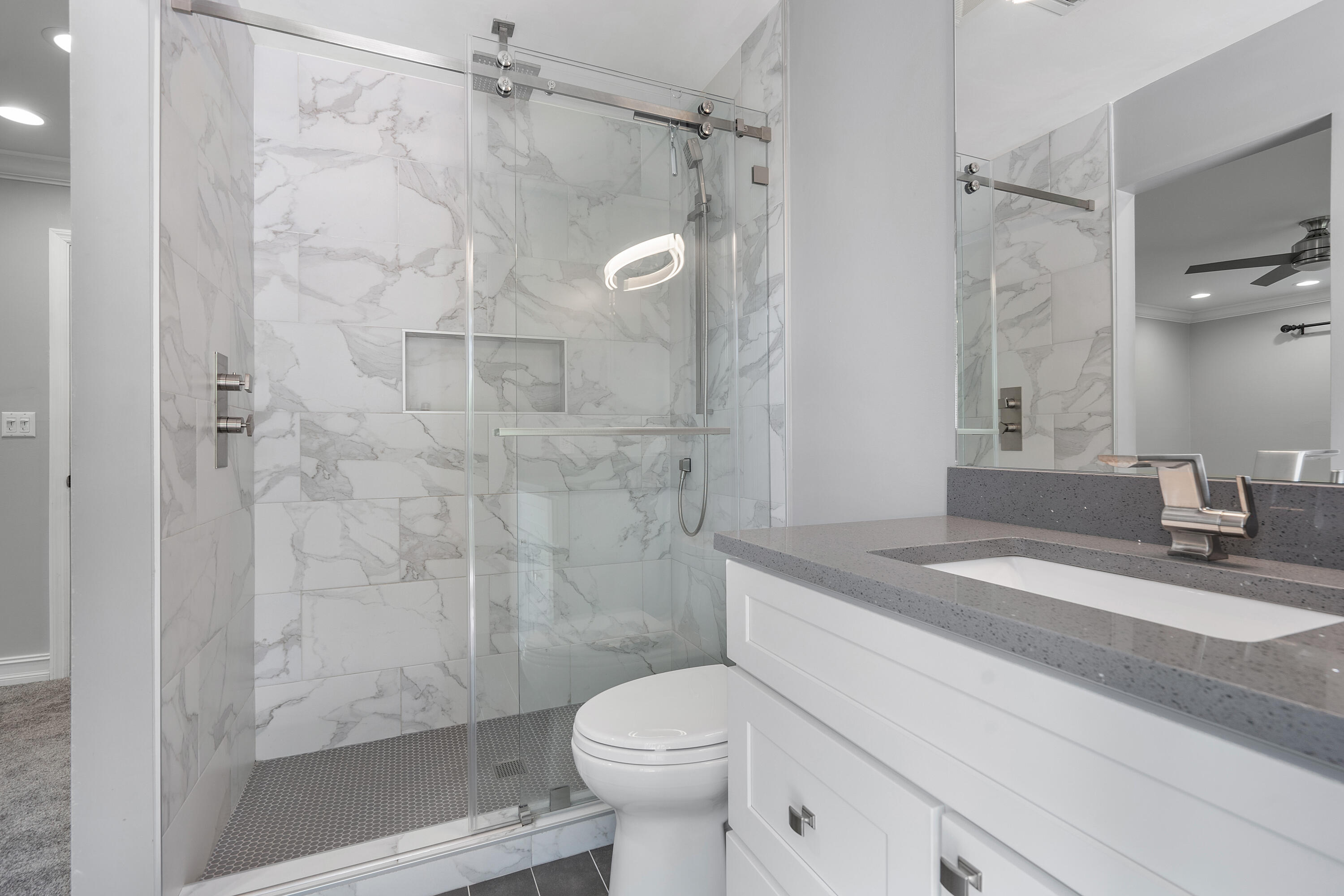 3289 Northwest 26th Avenue Boca Raton, FL 33434 - Photo 9 of 10 a bathroom with a sink toilet and shower