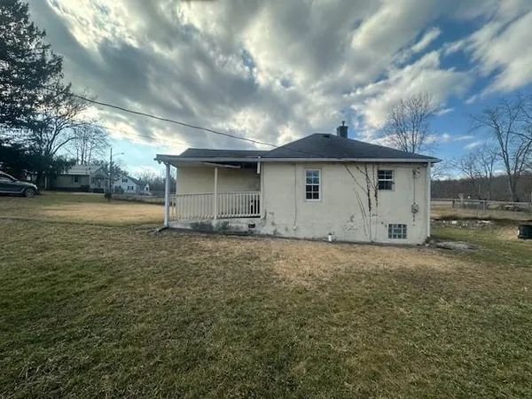 a backyard of a house with a yard and garage
