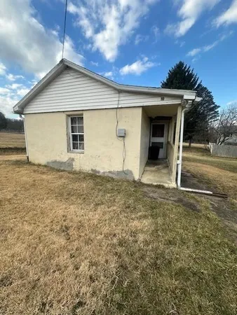 a view of backyard with cabin