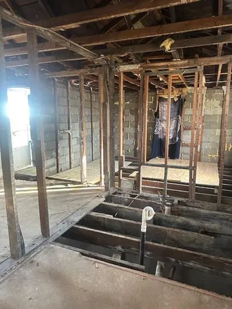 a view of a room with wooden walls