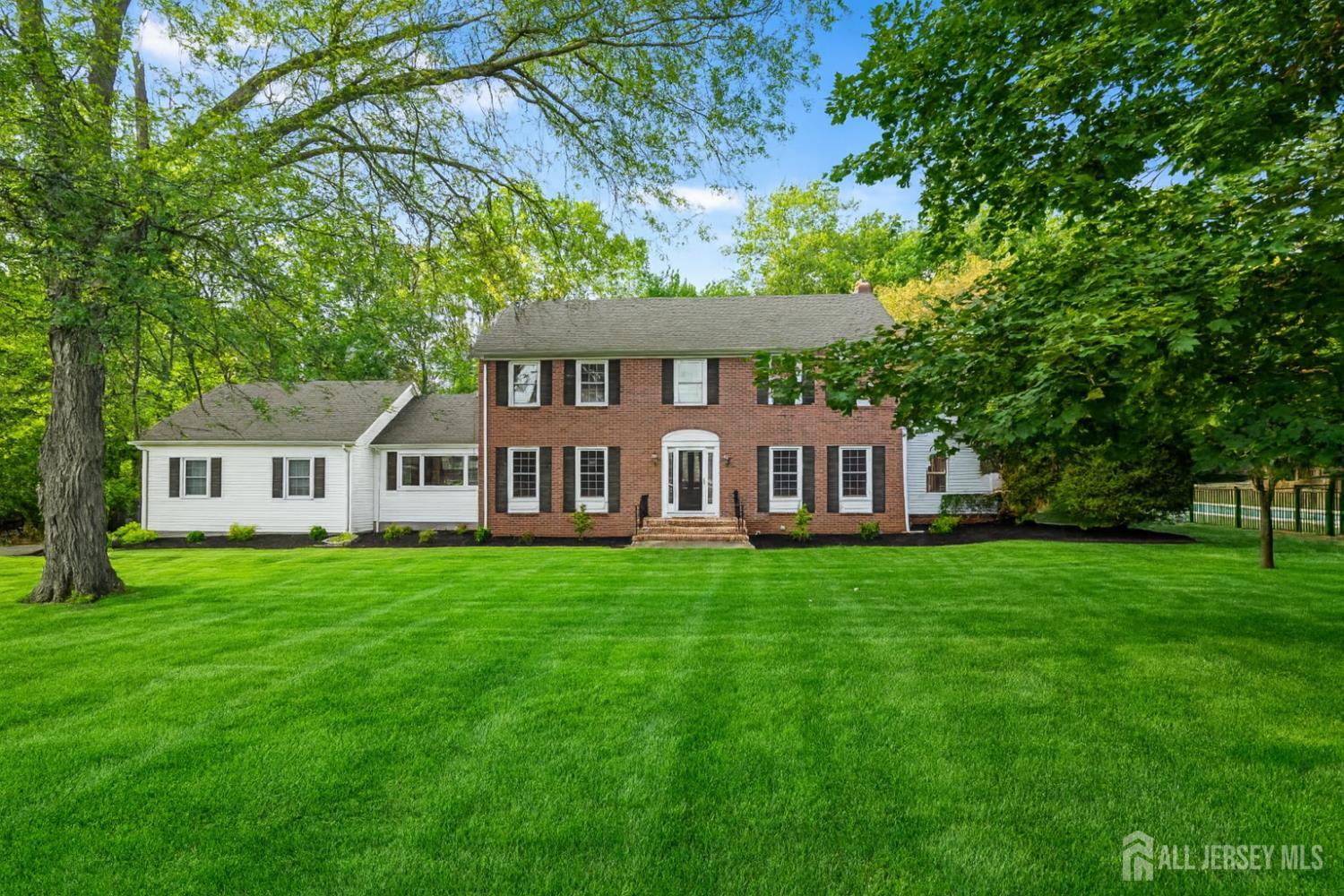 28 Southfield Road Edison, NJ 08820 - Photo 1 of 27 a front view of a house with a garden