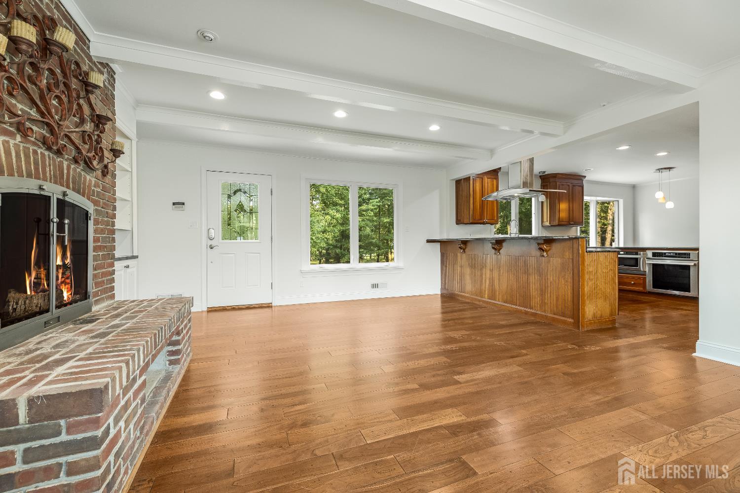 28 Southfield Road Edison, NJ 08820 - Photo 12 of 27 a view of kitchen living room with wooden floor and kitchen view