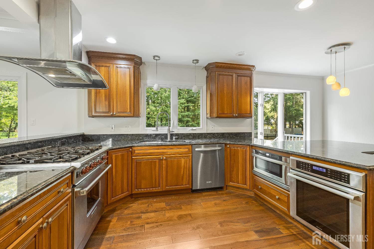 28 Southfield Road Edison, NJ 08820 - Photo 14 of 27 a kitchen with stainless steel appliances granite countertop a stove sink and cabinets