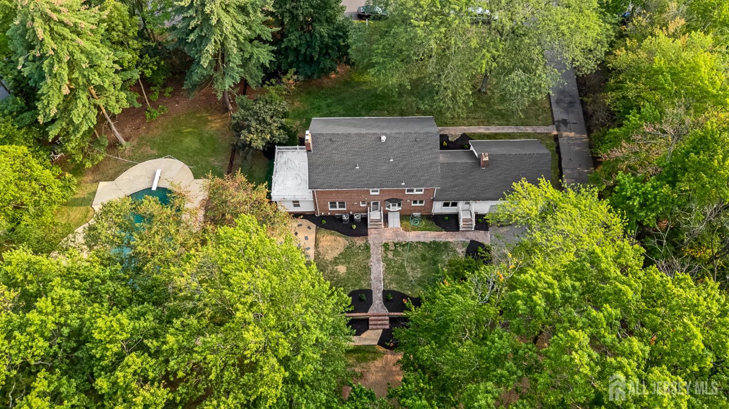 28 Southfield Road Edison, NJ 08820 - Photo 22 of 27 an aerial view of a house with a yard basket ball court and outdoor seating