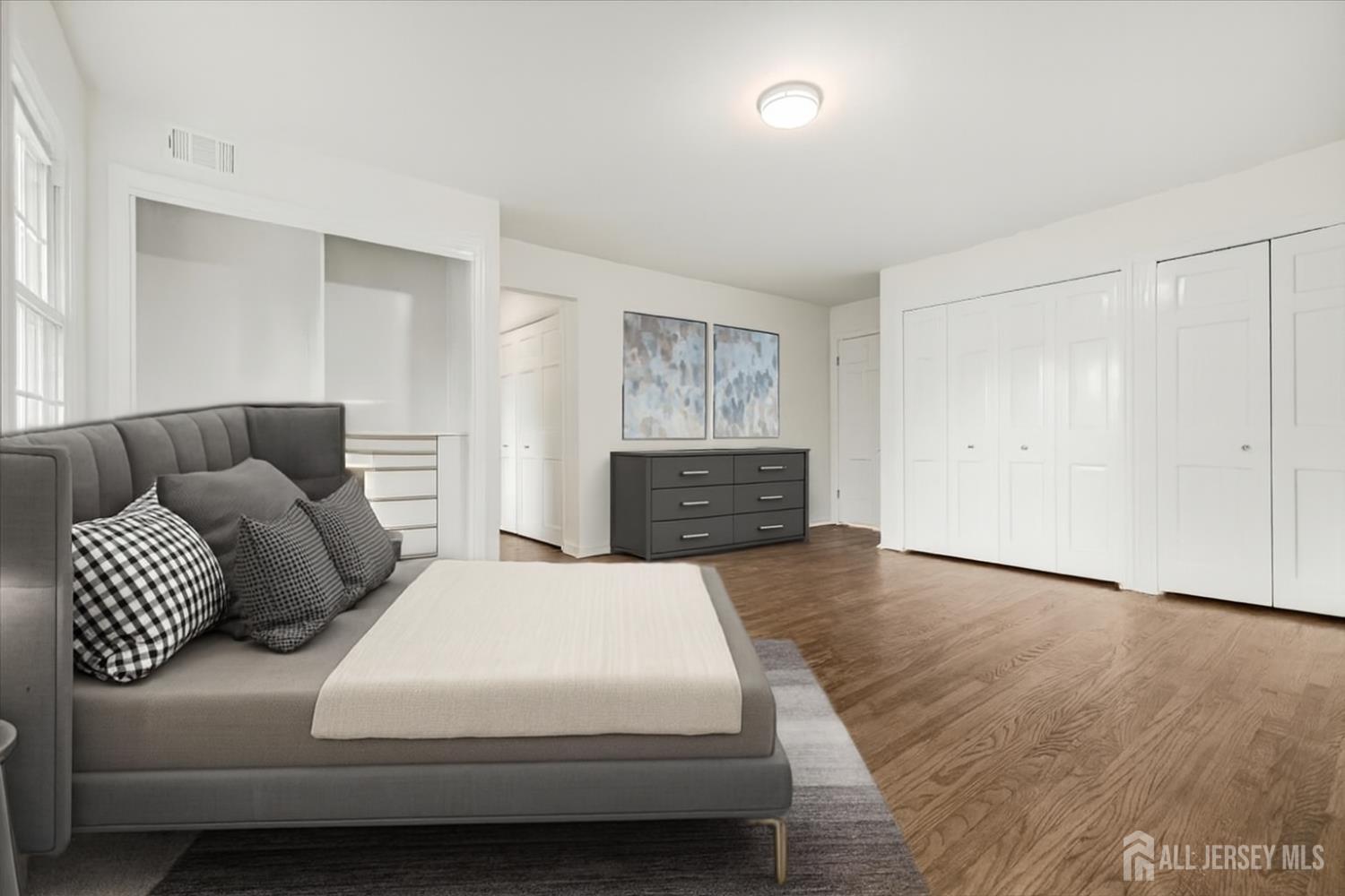 28 Southfield Road Edison, NJ 08820 - Photo 5 of 27 a bedroom with a bed and a couch