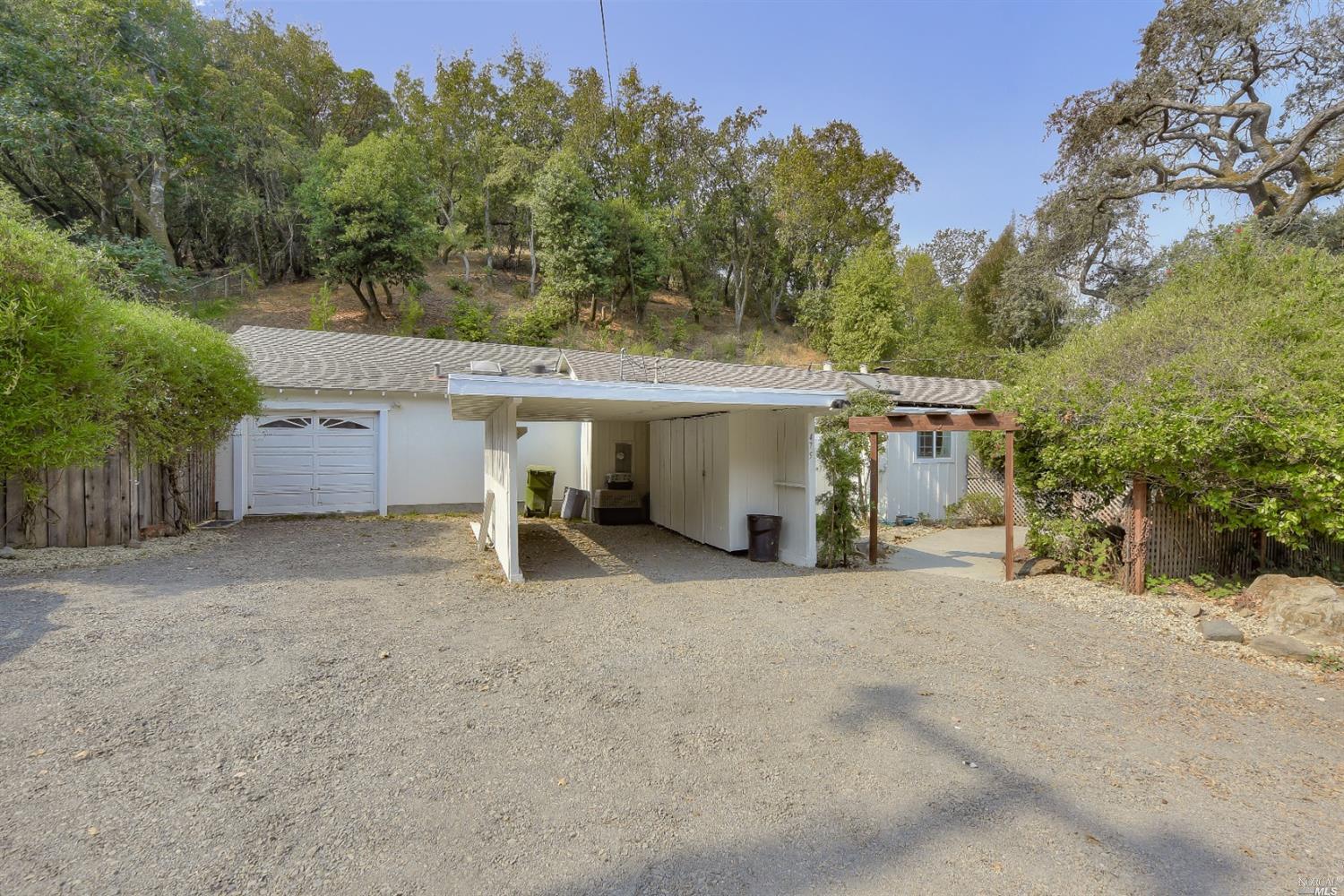 475 Ridge Road Novato, CA 94947 - Photo 1 of 1 a view of a house with a garage and trees
