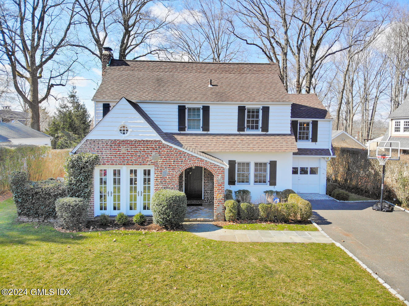 a front view of a house with a yard