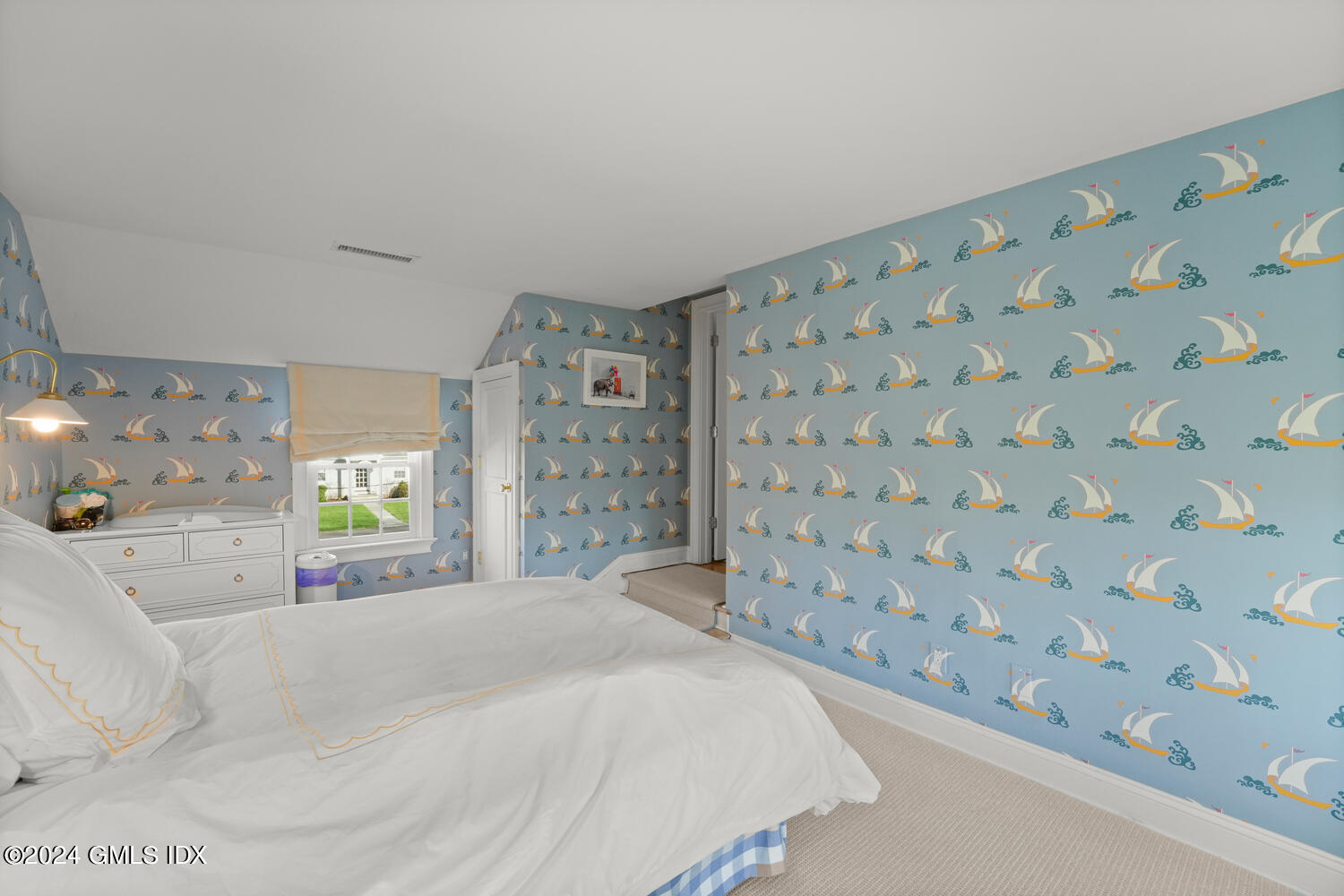 46 Terrace Avenue Riverside, CT 06878 - Photo 11 of 17 a bedroom with a bed and a lamp