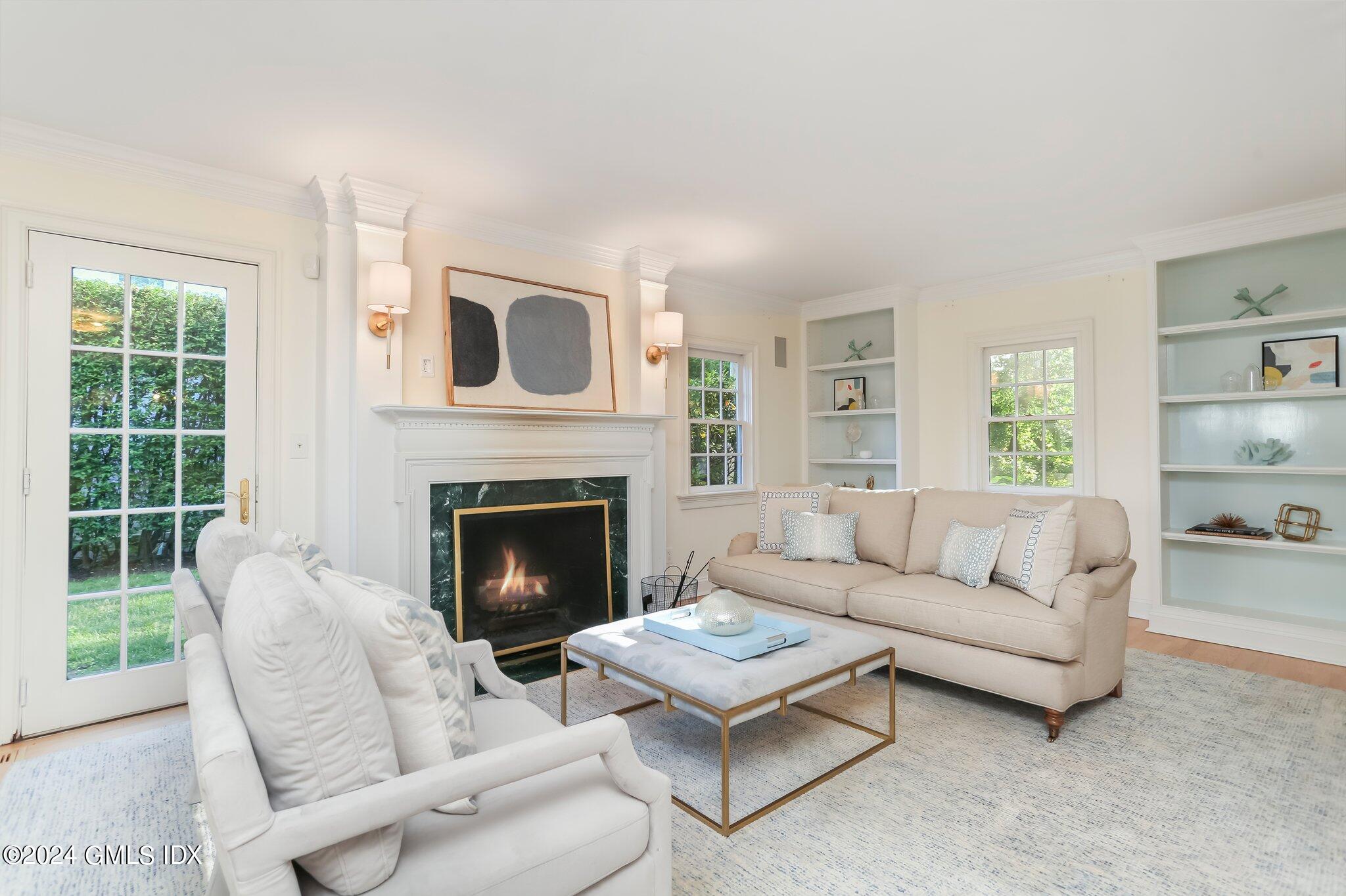 46 Terrace Avenue Riverside, CT 06878 - Photo 3 of 17 a living room with furniture a fireplace and window