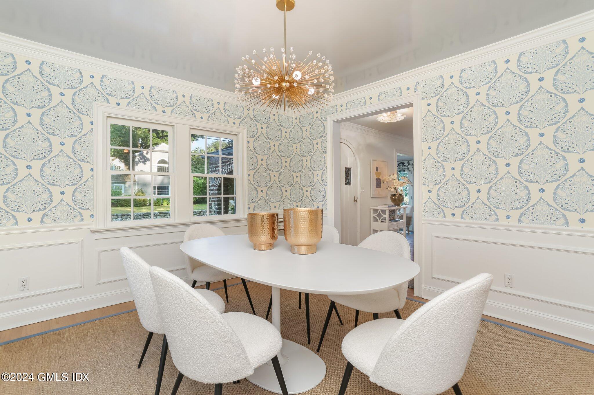 46 Terrace Avenue Riverside, CT 06878 - Photo 6 of 17 a view of a dining room with furniture and chandelier