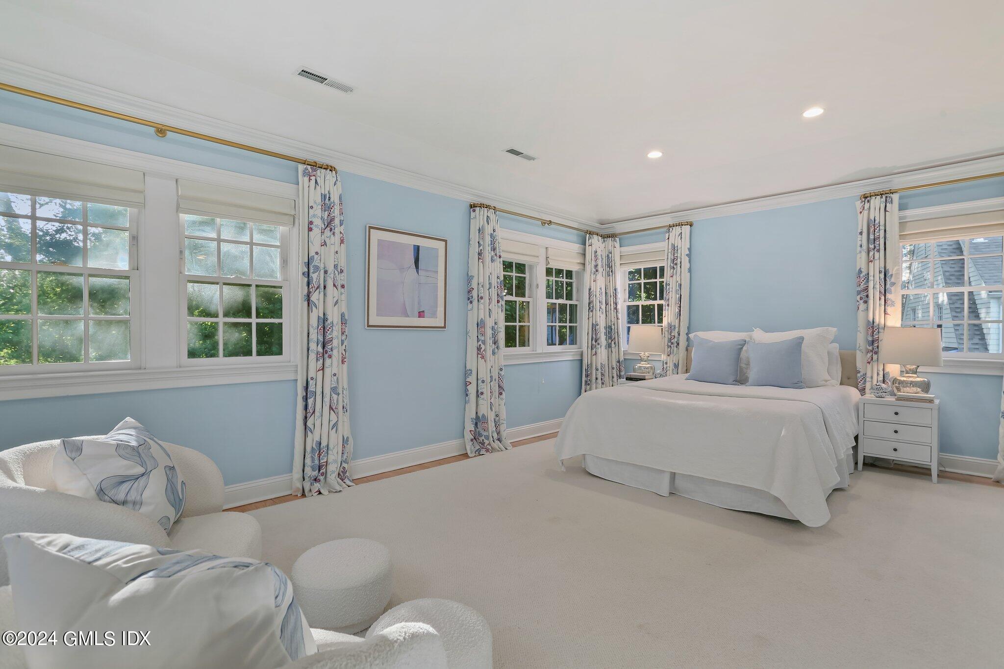 46 Terrace Avenue Riverside, CT 06878 - Photo 10 of 17 a spacious bedroom with a bed and glass window