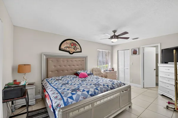 a kitchen with stainless steel appliances kitchen island granite countertop a table chairs in it and wooden floors