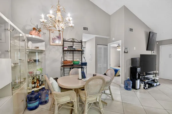 a kitchen with a table and chairs in it