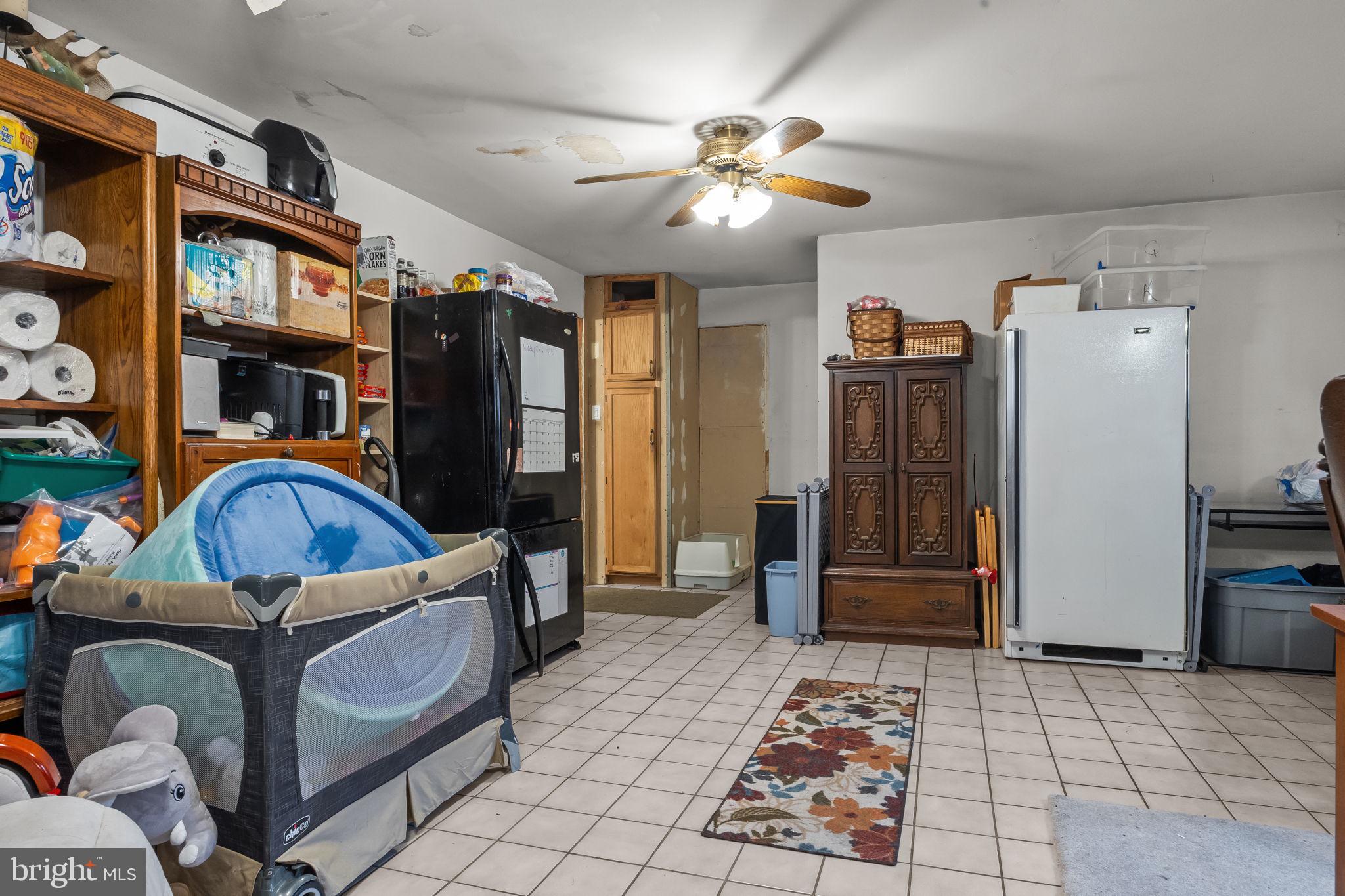 65 Silverspruce Road Levittown, PA 19056 - Photo 15 of 32 a bedroom with furniture a lamp and a window