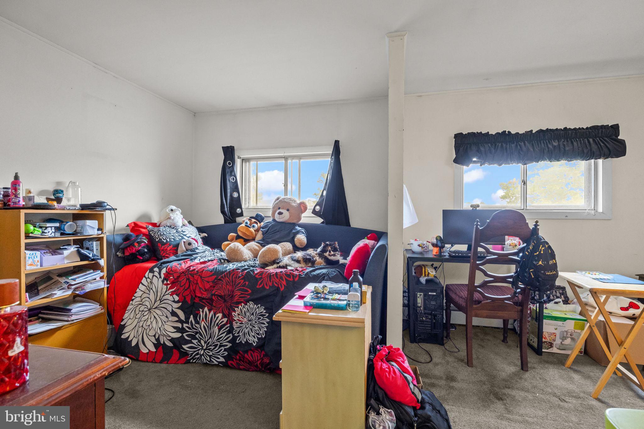 65 Silverspruce Road Levittown, PA 19056 - Photo 24 of 32 a bedroom with bed and a window