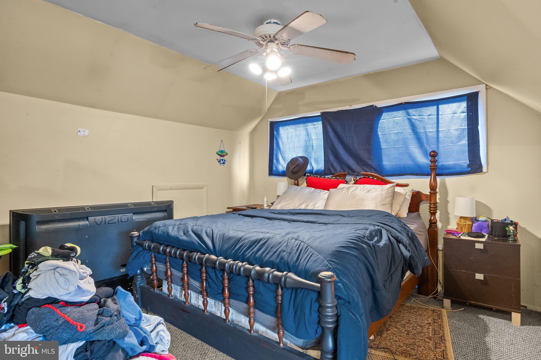 65 Silverspruce Road Levittown, PA 19056 - Photo 26 of 32 a bedroom with a bed and a window