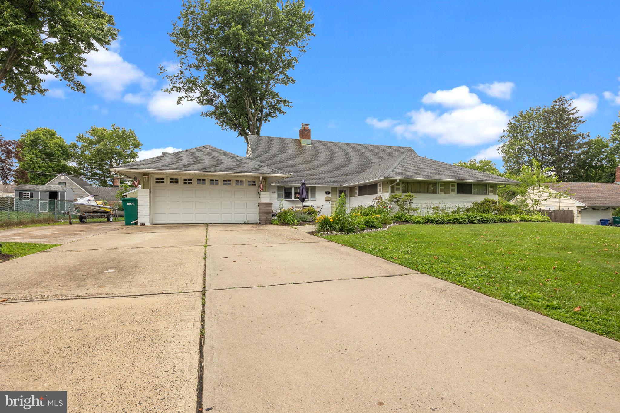 65 Silverspruce Road Levittown, PA 19056 - Photo 32 of 32 a view of a house with a yard and large tree